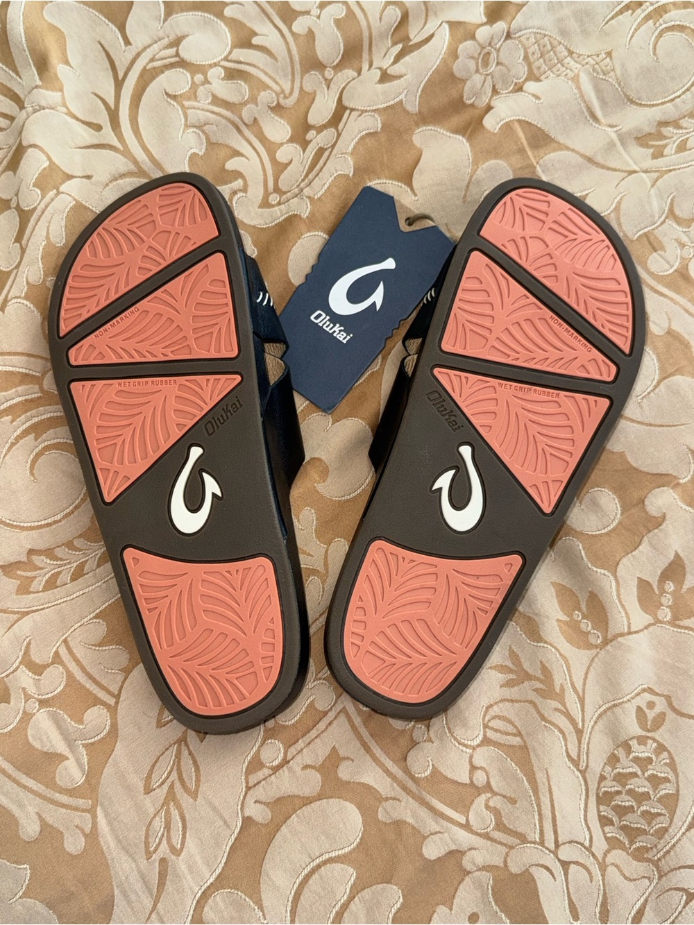 OluKai Women’s Slide Sandals in Coral and Black